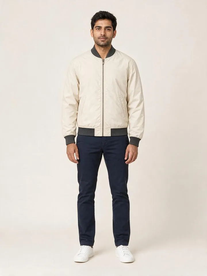 The same shopper wearing the cream bomber jacket